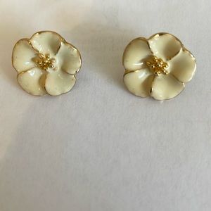 Enameled “flower” earrings, off white with gold tone trim.